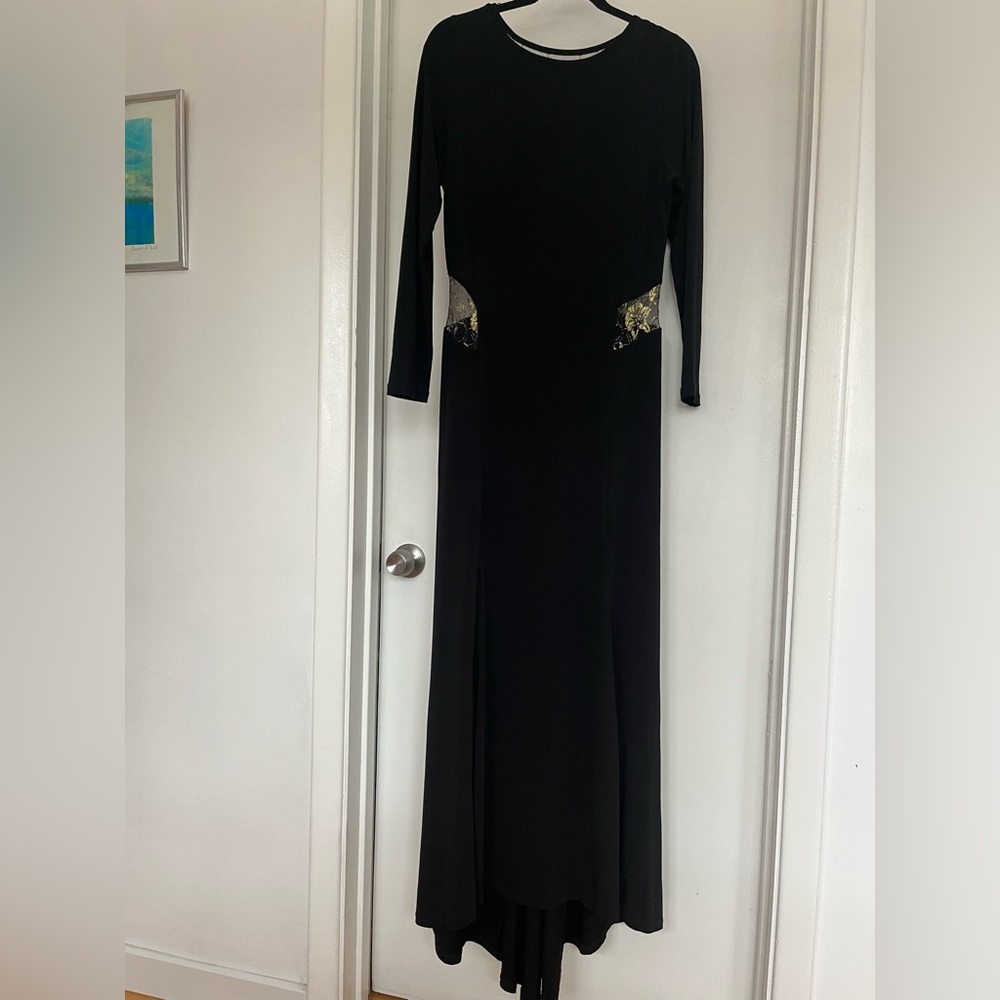 A sleek Long black gown w/ sheer gold inset design, front & back. Long sleeve.